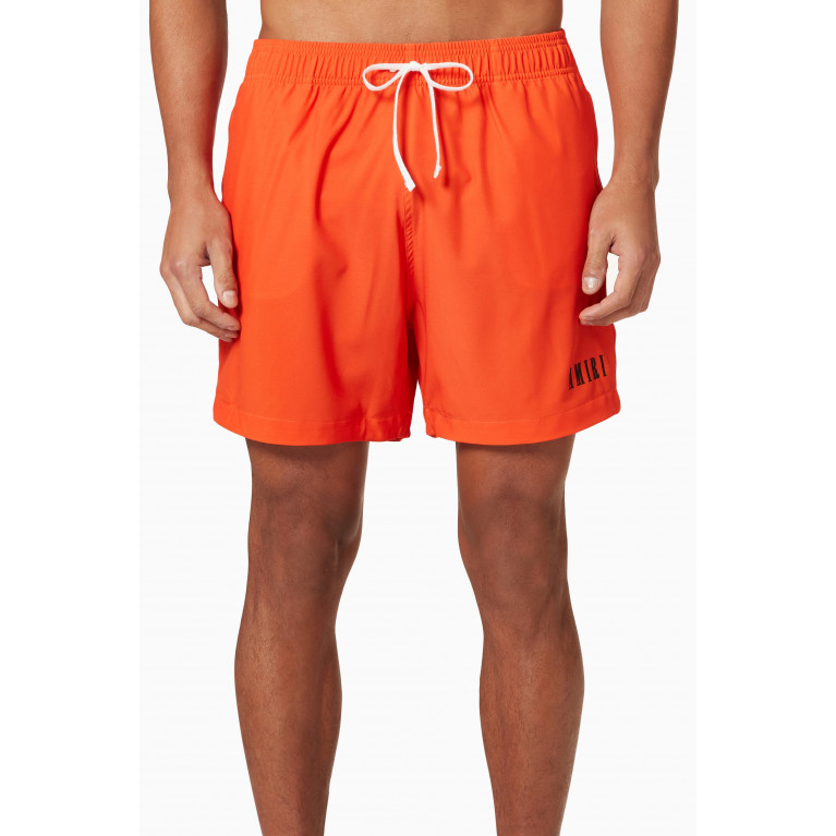 Amiri - Core Logo Swim Trunks in Nylon Orange