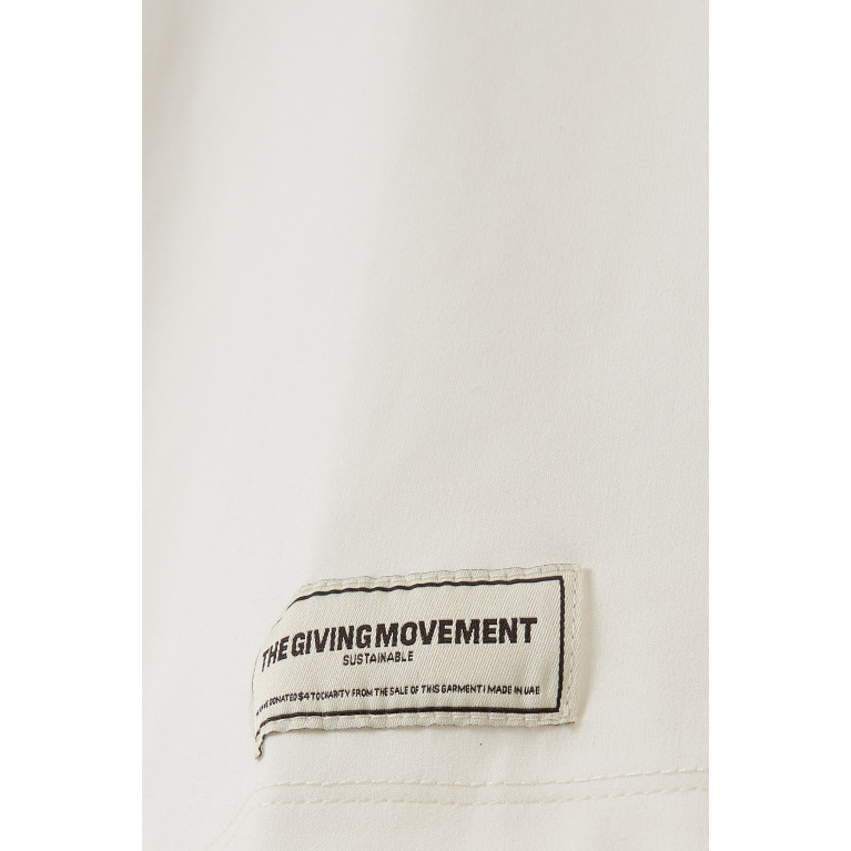 The Giving Movement - Logo Oversized T-shirt in SOFTSKIN100© Neutral