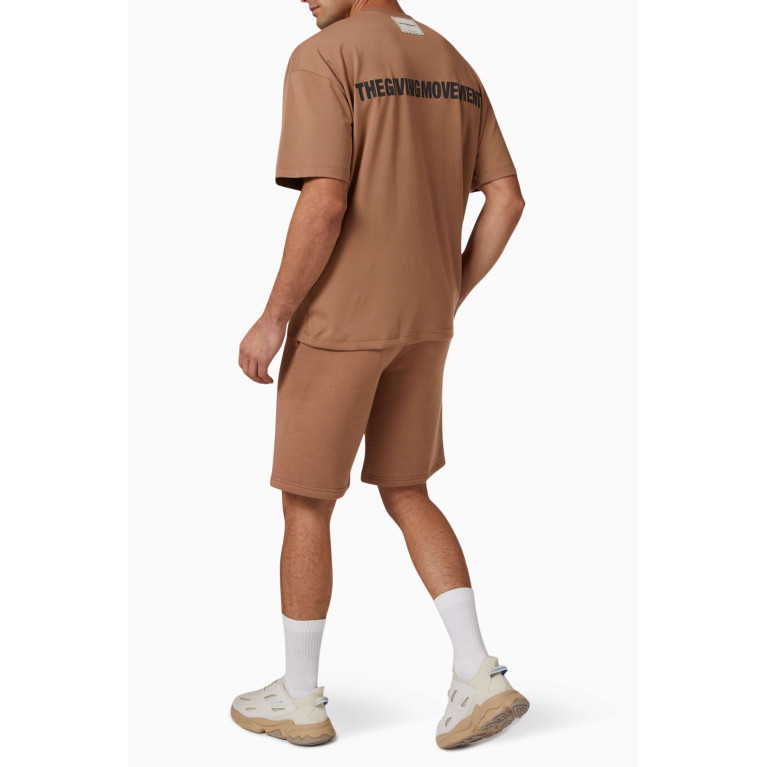 The Giving Movement - Oversized T-shirt in Light SOFTSKIN100© Neutral