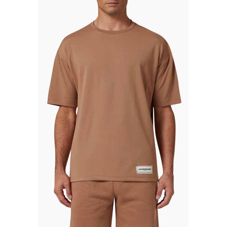 The Giving Movement - Oversized T-shirt in Light SOFTSKIN100© Neutral
