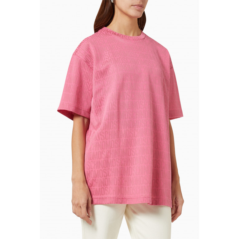 Moschino - All-over Logo Oversized T-shirt in Jersey Pink