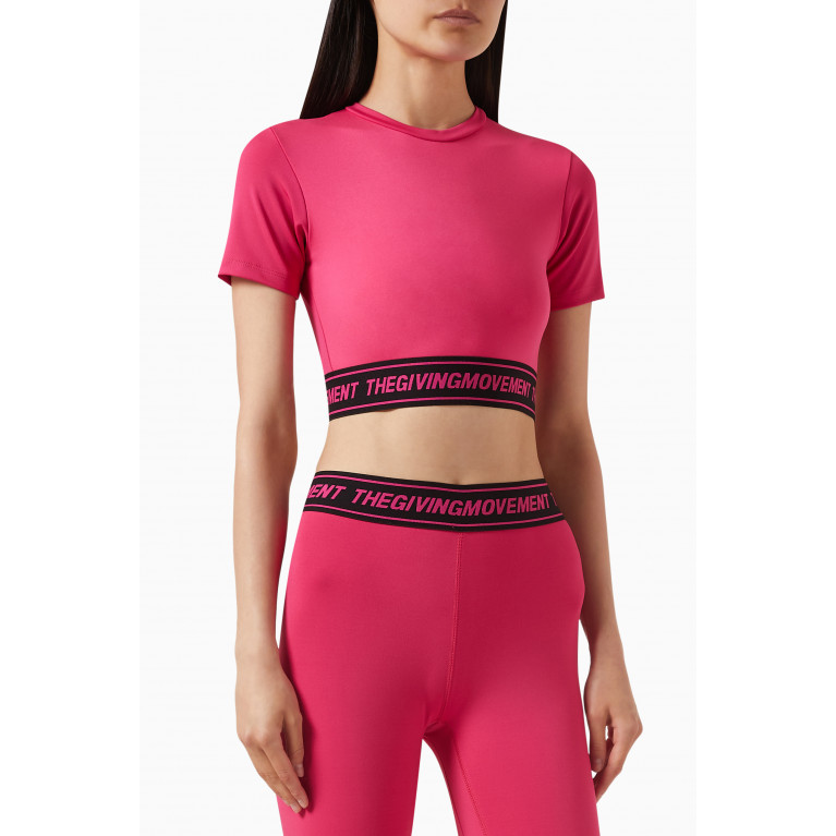 The Giving Movement - Logo Waistband Crop Top in Light Softskin100© Pink