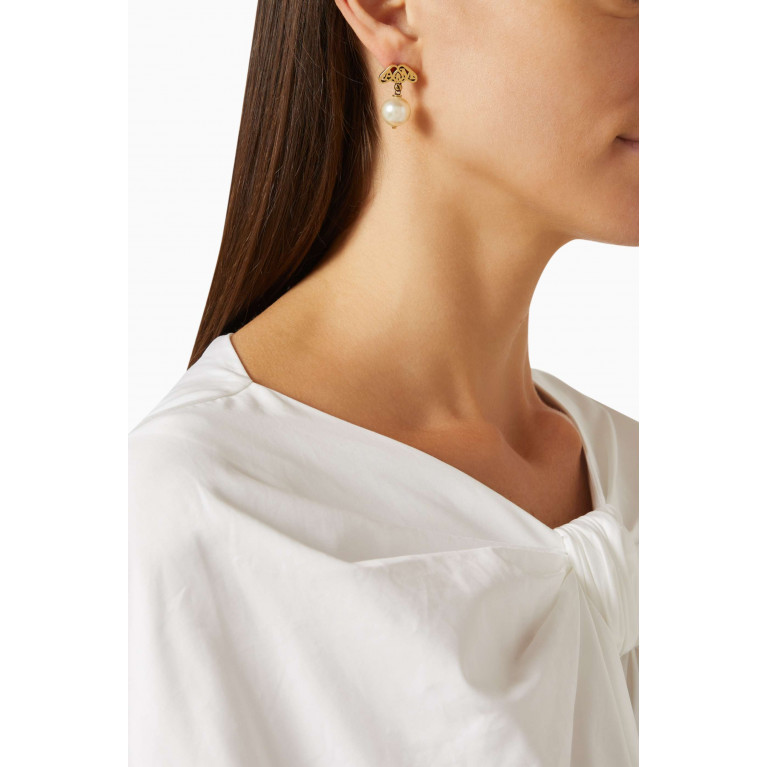 Alexander McQueen - Seal Logo Earrings in Brass