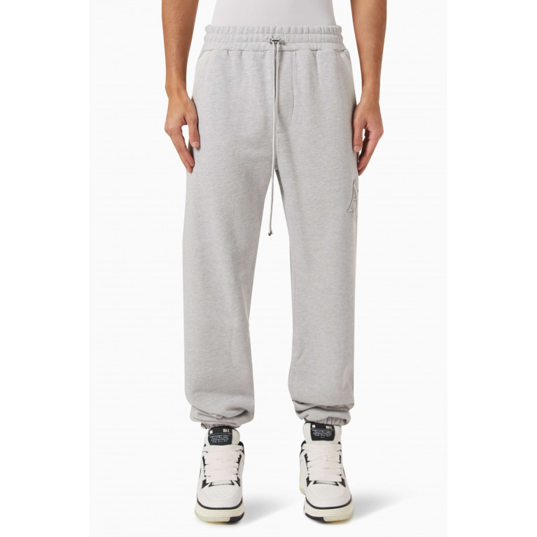 Amiri - Staggered Logo Sweatpants in Cotton Terry