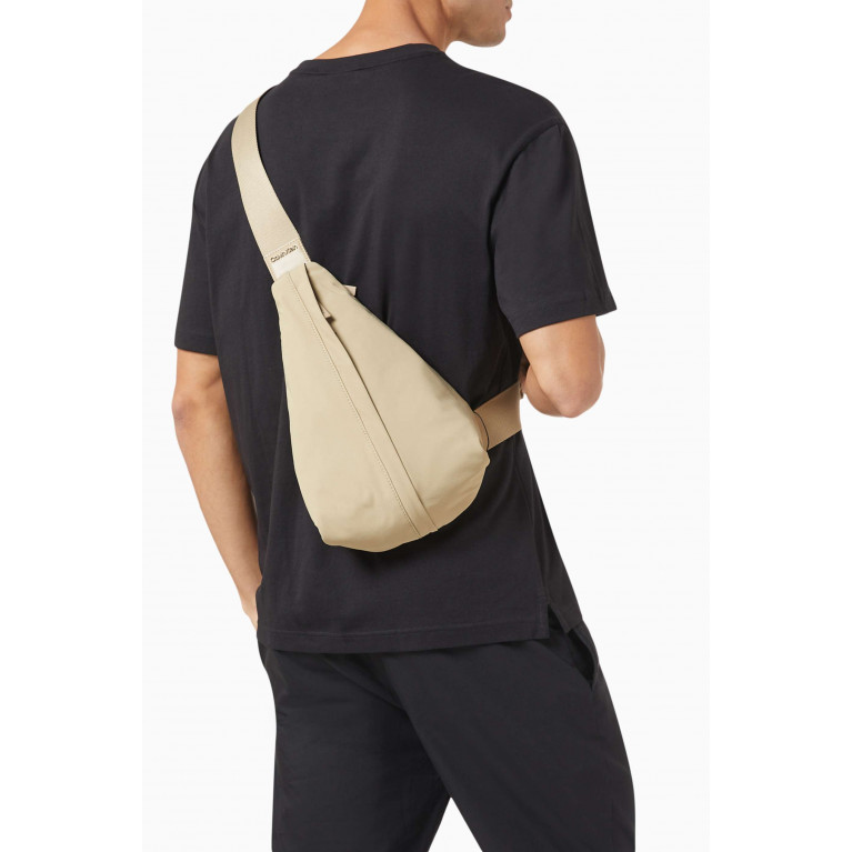 Calvin Klein - Faded Sling Bag in Synthetic Fabric Neutral