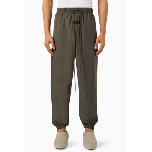 Fear of God Essentials - Logo Trackpants in Stretch Woven Nylon