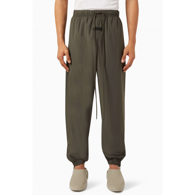 Fear of God Essentials - Logo Trackpants in Stretch Woven Nylon